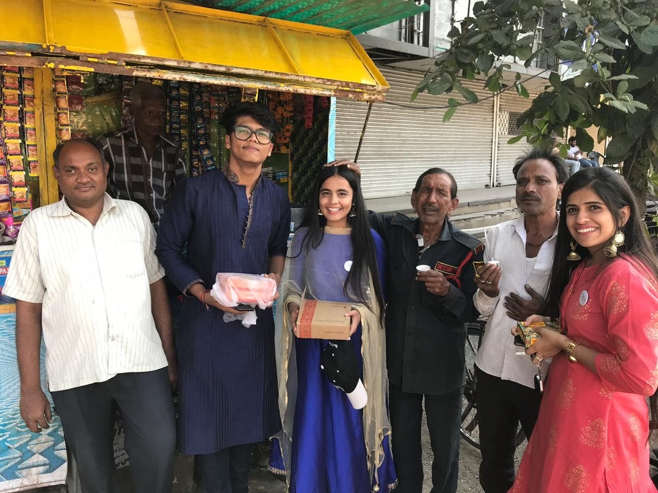 Two volunteers with an elderly man at the old age home