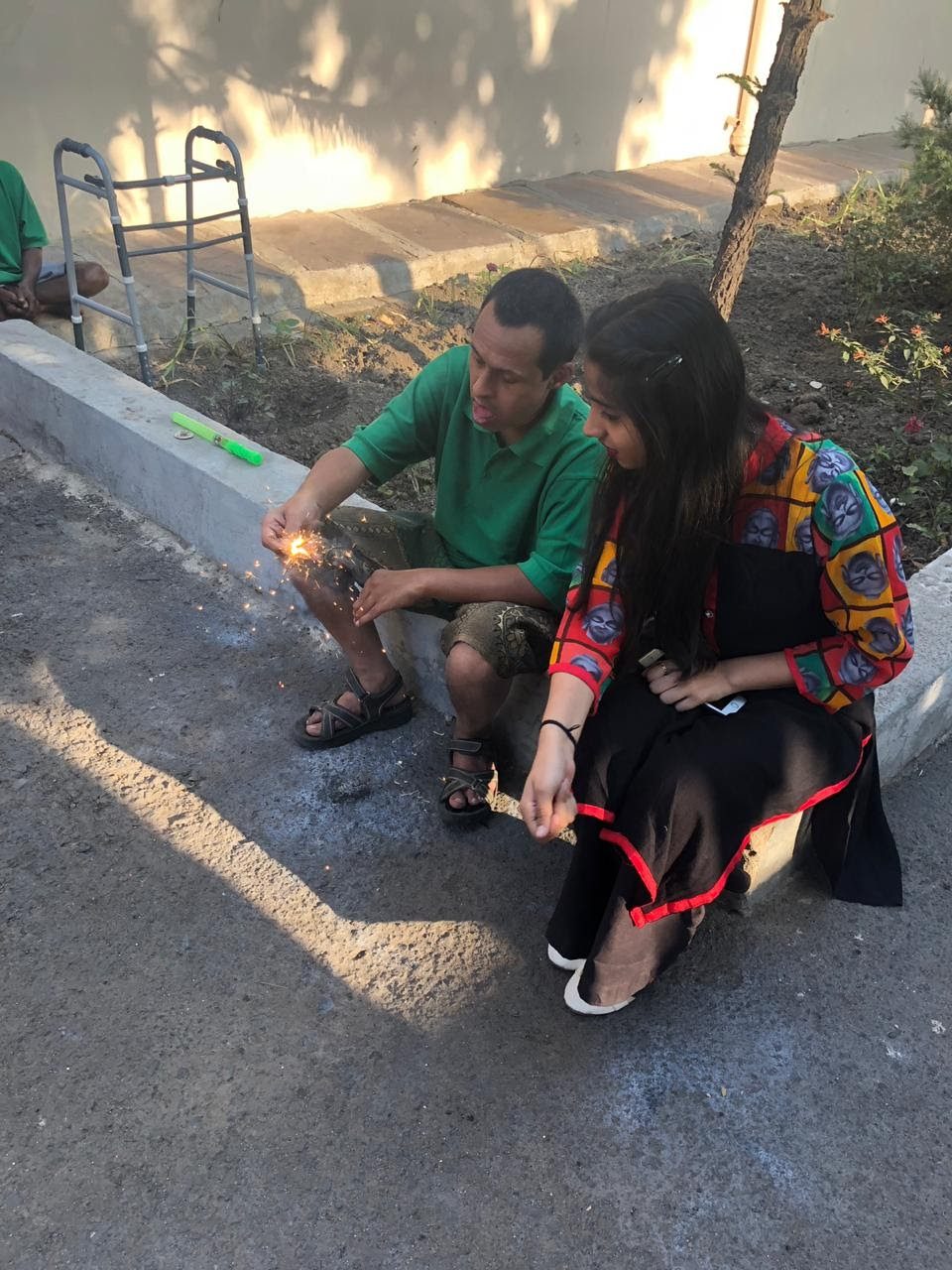 Volunteer and elderly resident sharing a warm moment