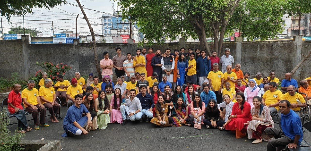Volunteers with police officers outside a police station in Indore