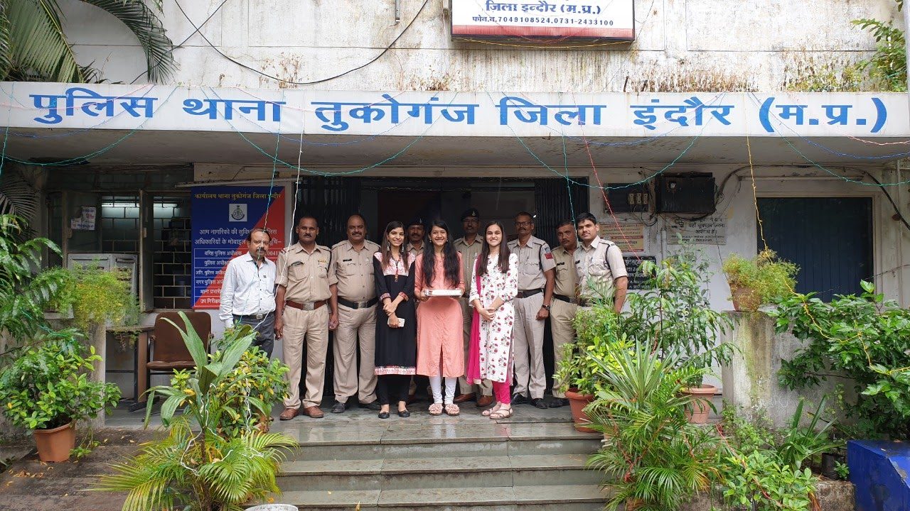 Group of volunteers taking a selfie with security staff